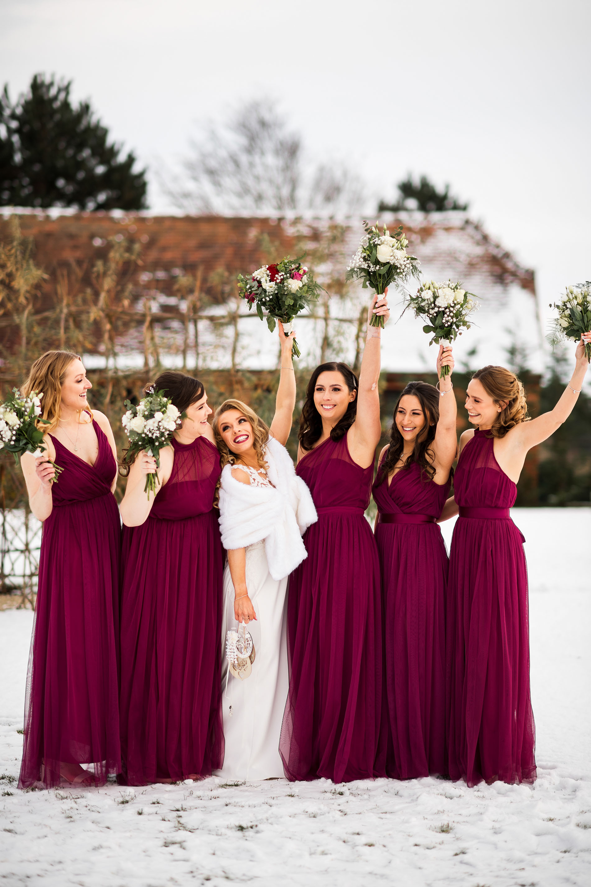 bride and bridesmaids in the snow